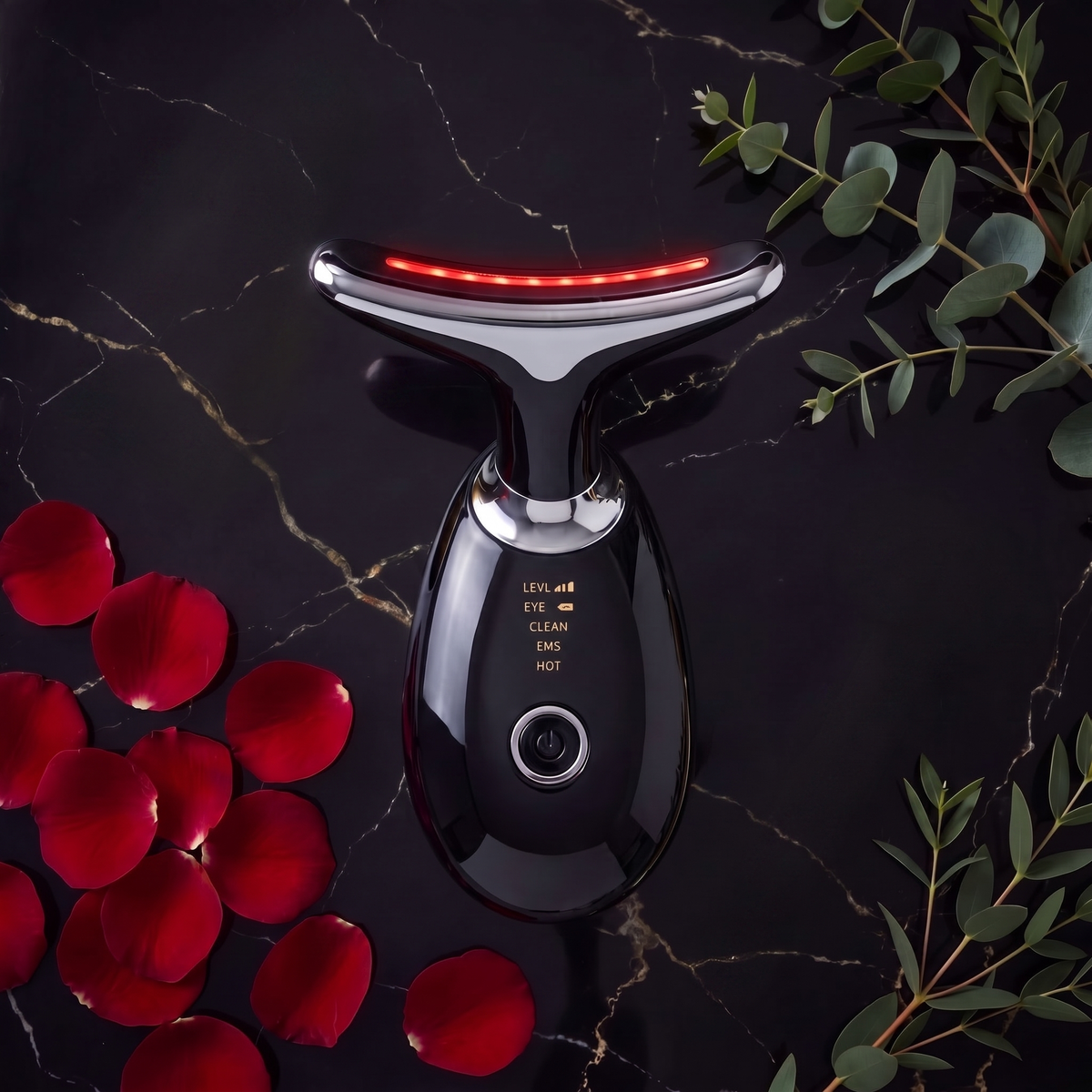 LumiSculpt Pro 7-Color LED Therapy Facial Sculptor in Onyx Black on dark marble with rose petals